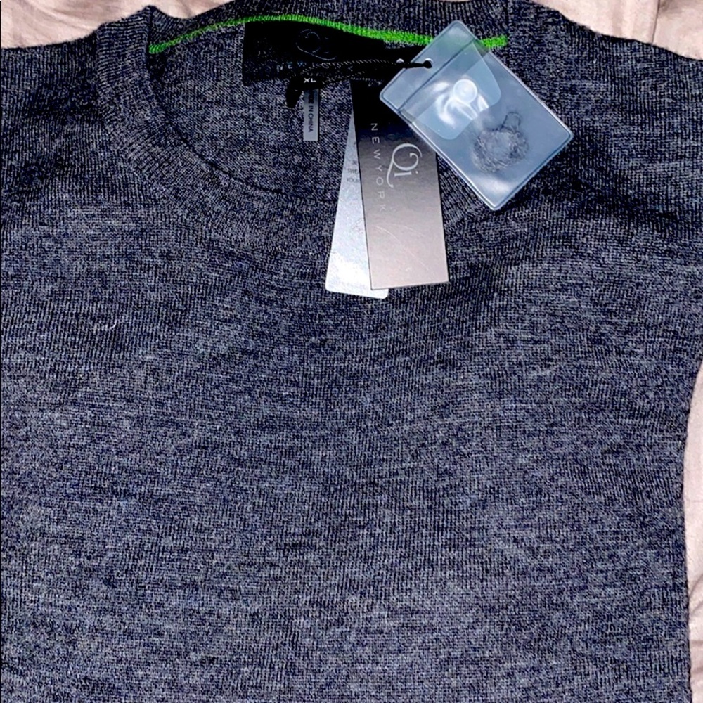 Qi high quality sweater. Never worn and new.